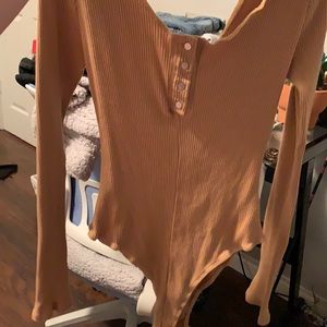 Slightly off the shoulder body suit